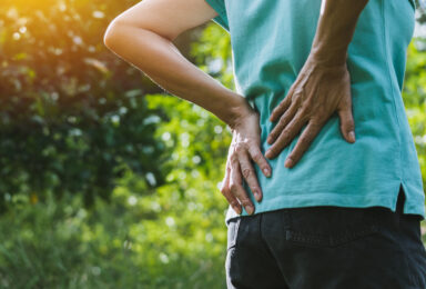 Woman touching back