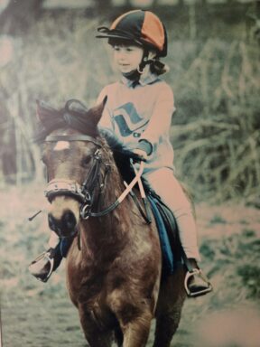 a girl riding a horse